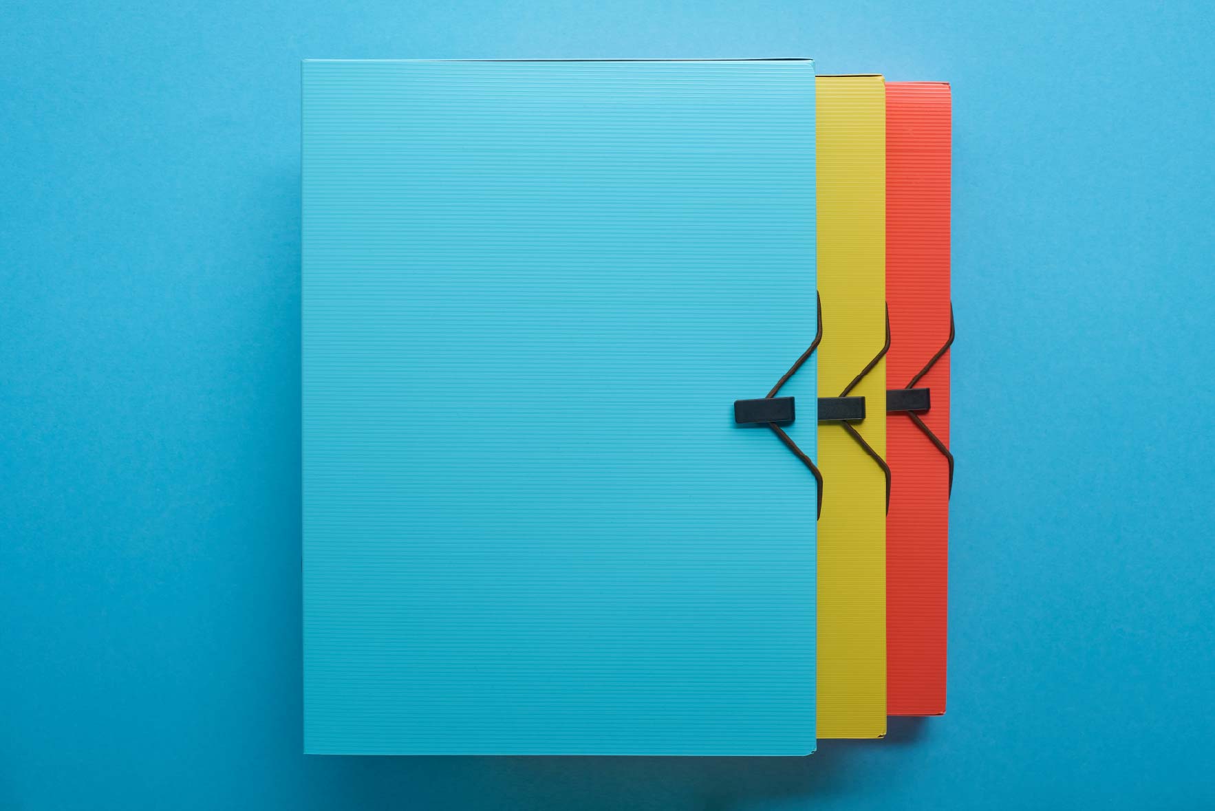 top-view-of-multicolored-paper-binders-in-row